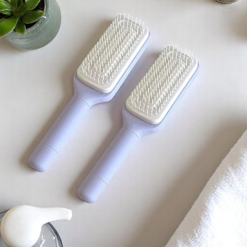 Two self-cleaning hair brushes in black and purple colors, with an additional inset showing the brush's bristles.