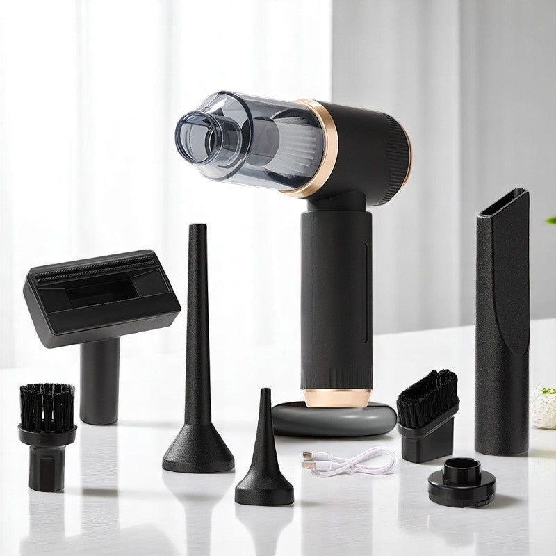 Black handheld vacuum cleaner with various attachments on a white surface
