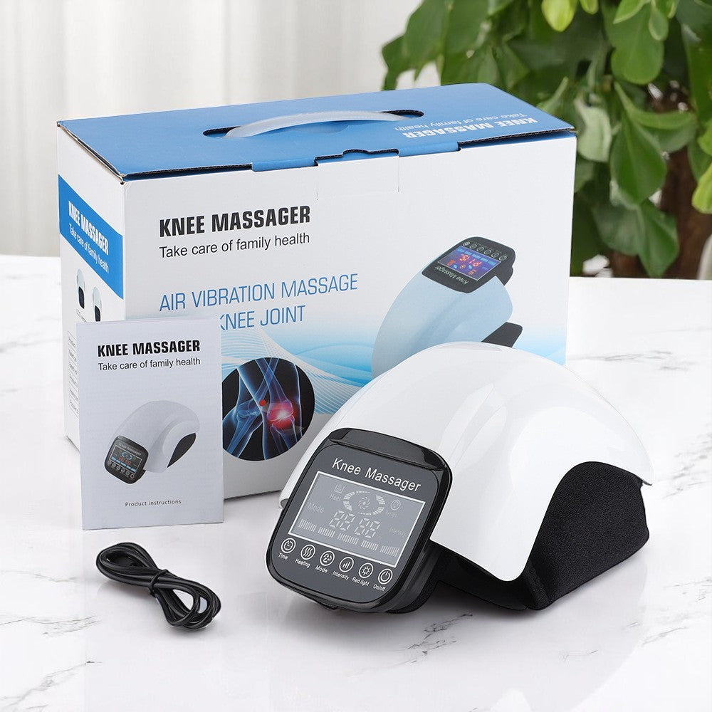 Knee massager with packaging on a white surface