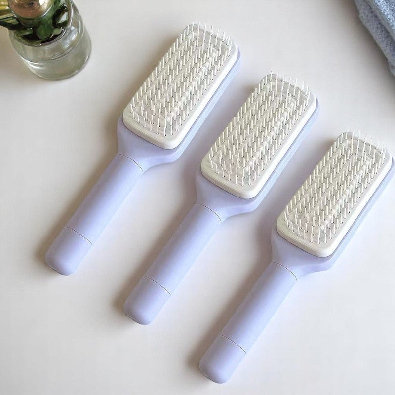 Two self-cleaning hair brushes in black and purple colors, with an additional inset showing the brush's bristles.