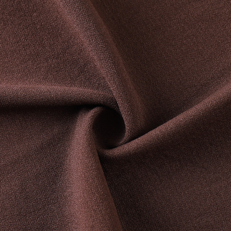 Close-up of brown fabric with folds