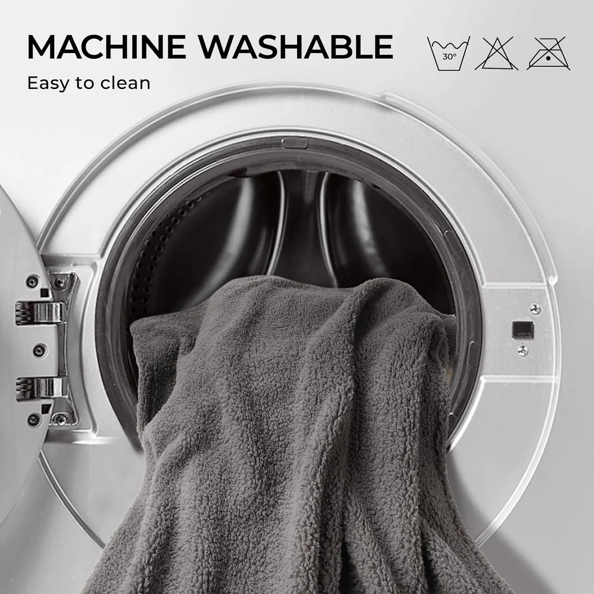 Gray towel inside a washing machine with 'Machine Washable' text and icons.