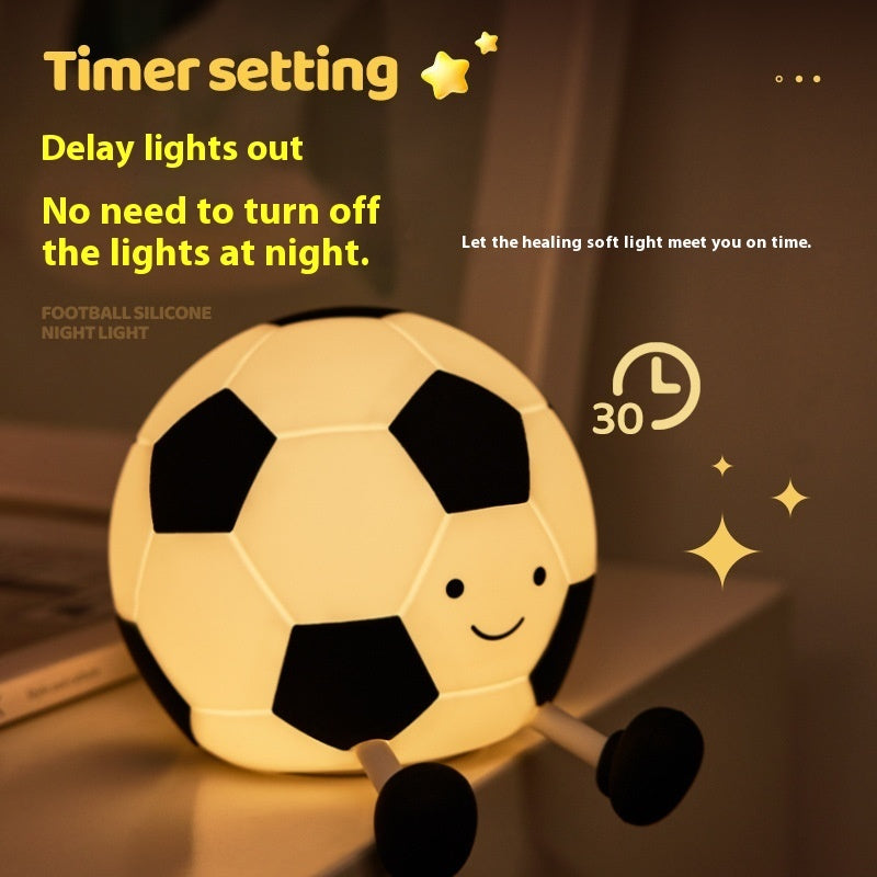 Soccer ball-shaped night light with timer setting text on a dark background