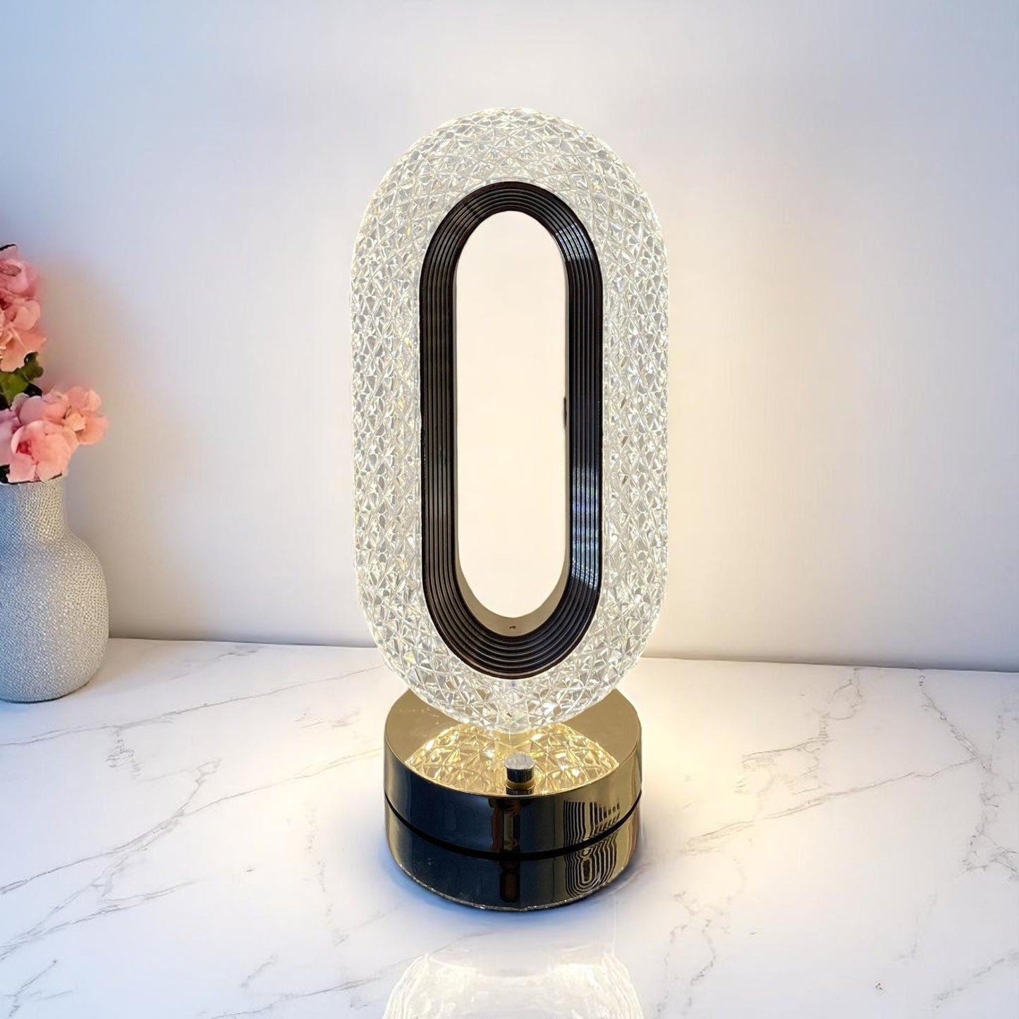 Decorative lamp with crystal-like design on a marble surface