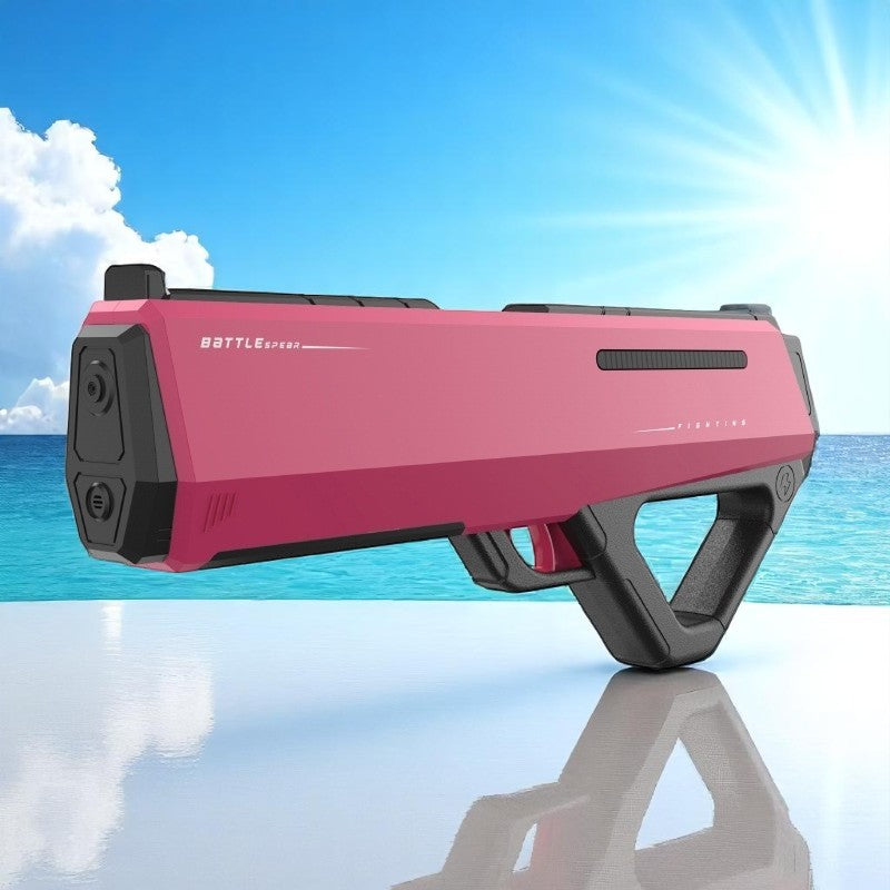 Pink and black toy gun with 'BATTLE' branding on a reflective surface with a blue sky and ocean background.