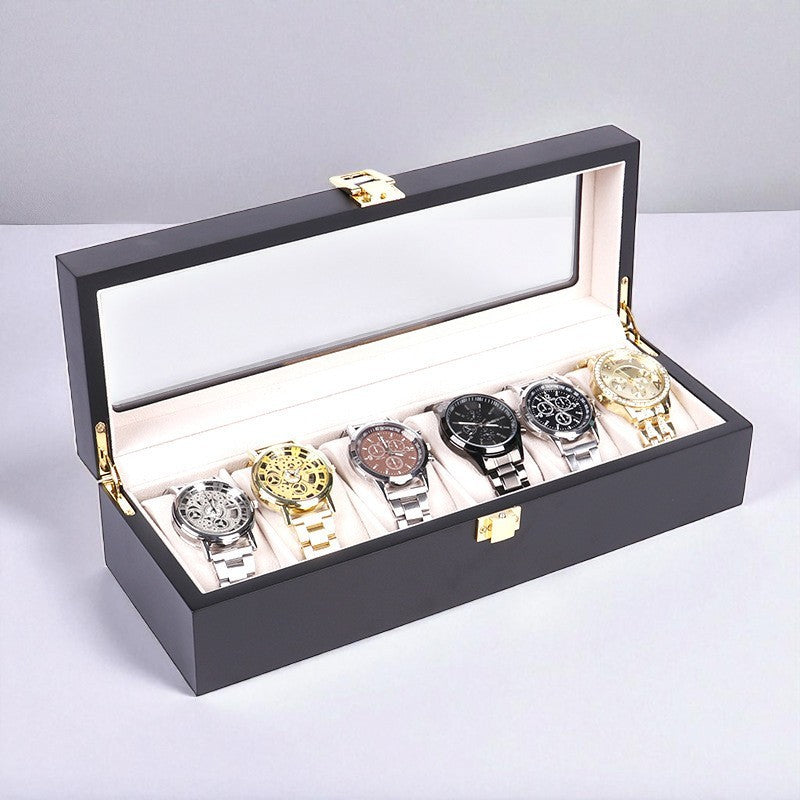 Luxury black watch box with six watches displayed on a light gray background