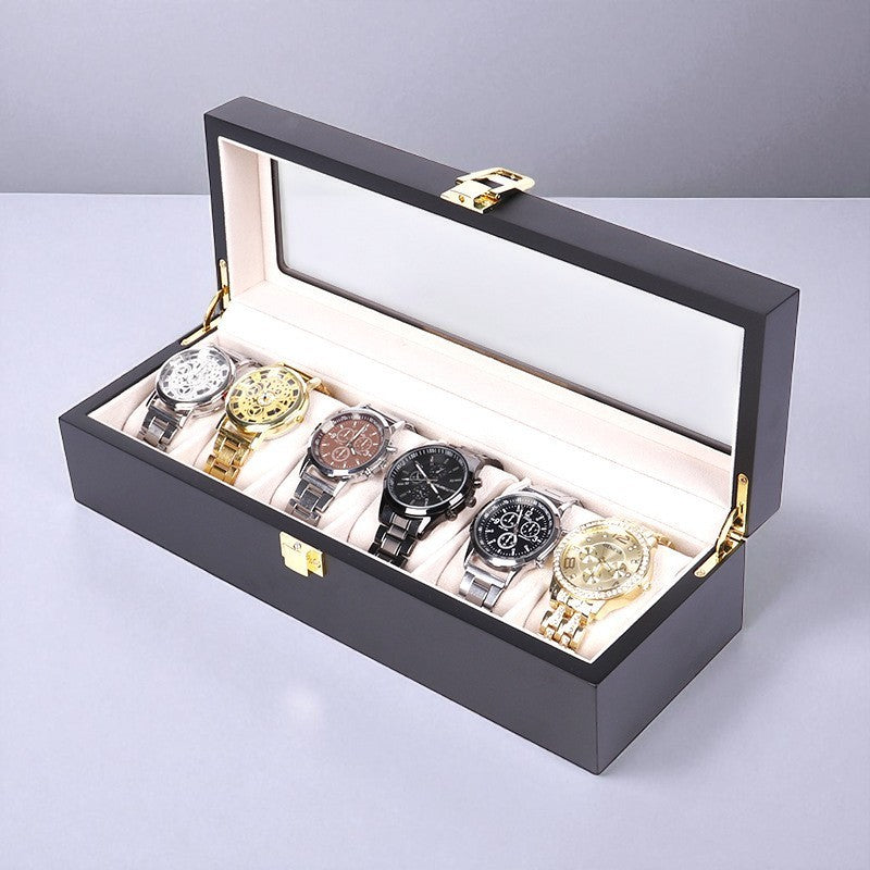Luxury black watch box with six watches displayed on a light gray background