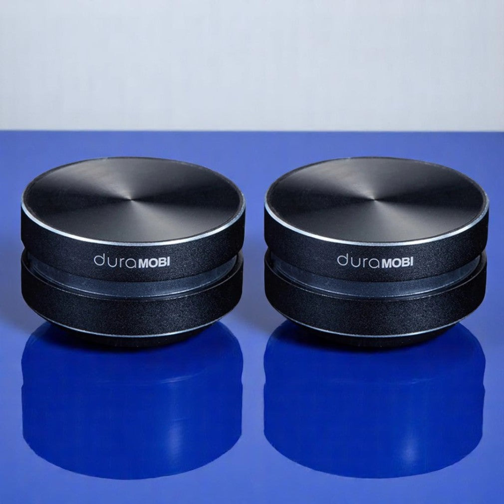 A compact and sleek black mini bone conduction speaker with the brand name 'DURAMOBI' visible on the top surface.