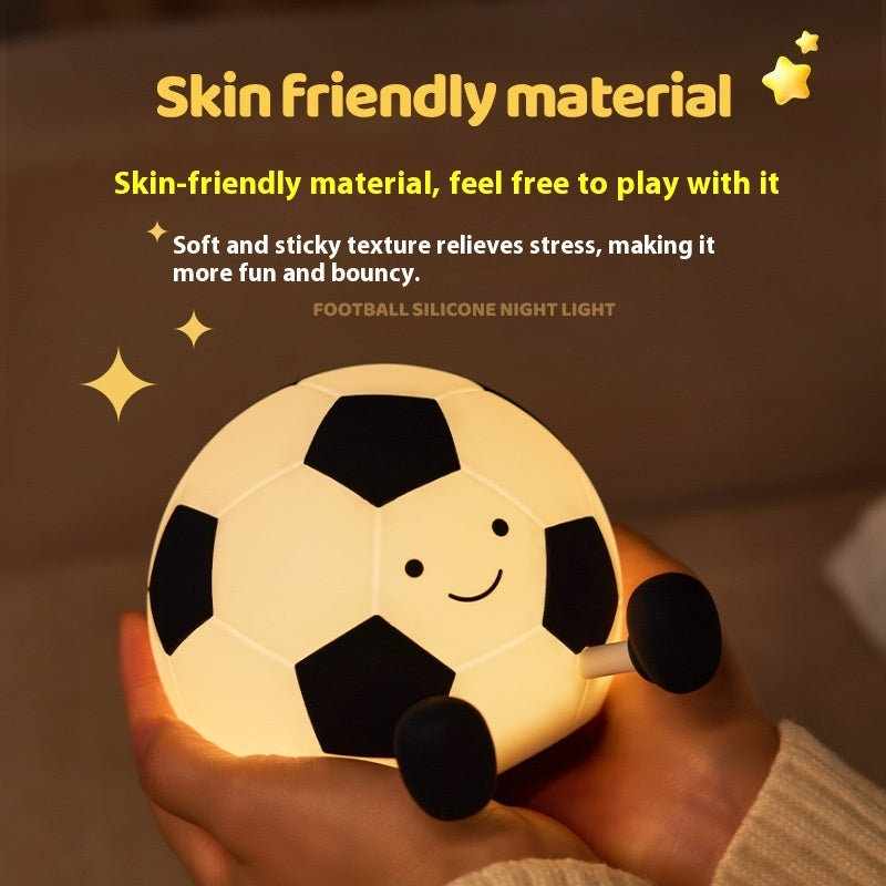 Football-shaped silicone night light held in a hand with text about skin-friendly material.