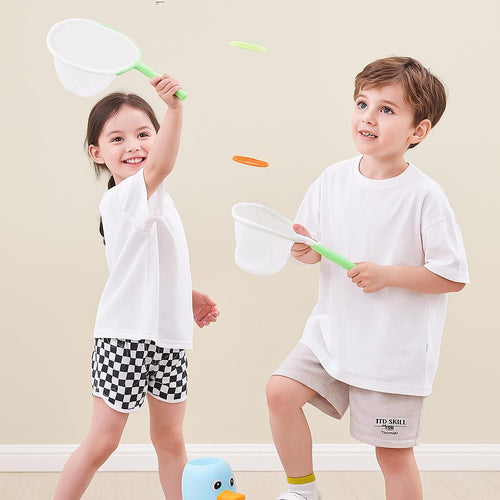 Two children playing with butterfly nets on a plain background