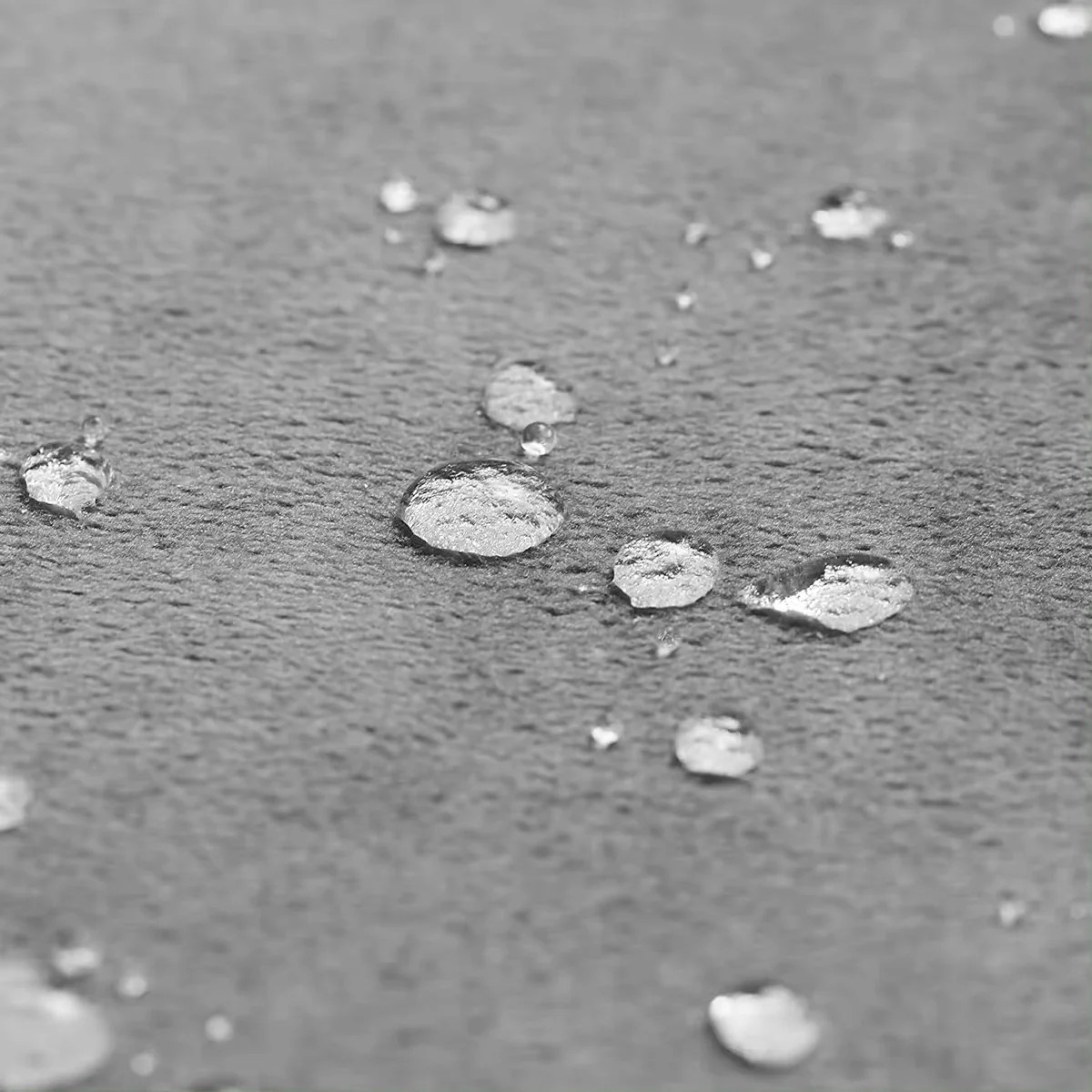 Close-up of water droplets on a textured surface