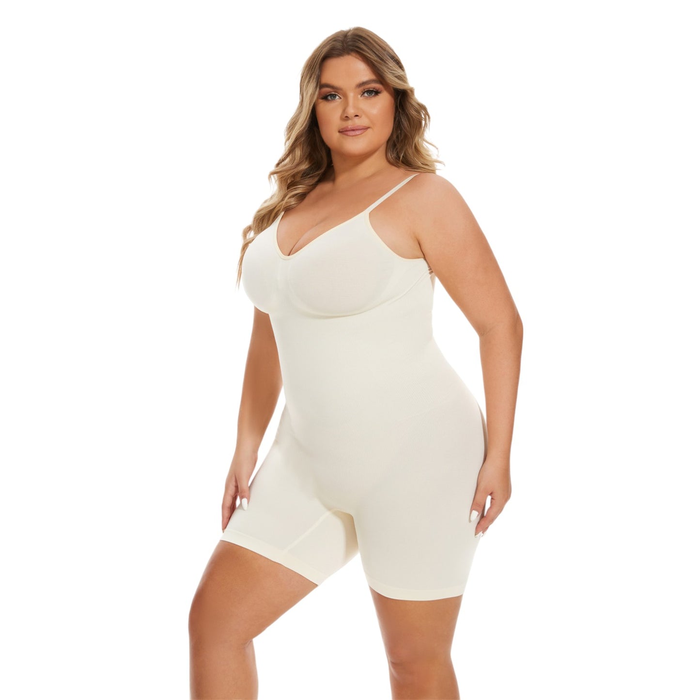 Woman wearing a white bodysuit against a white background