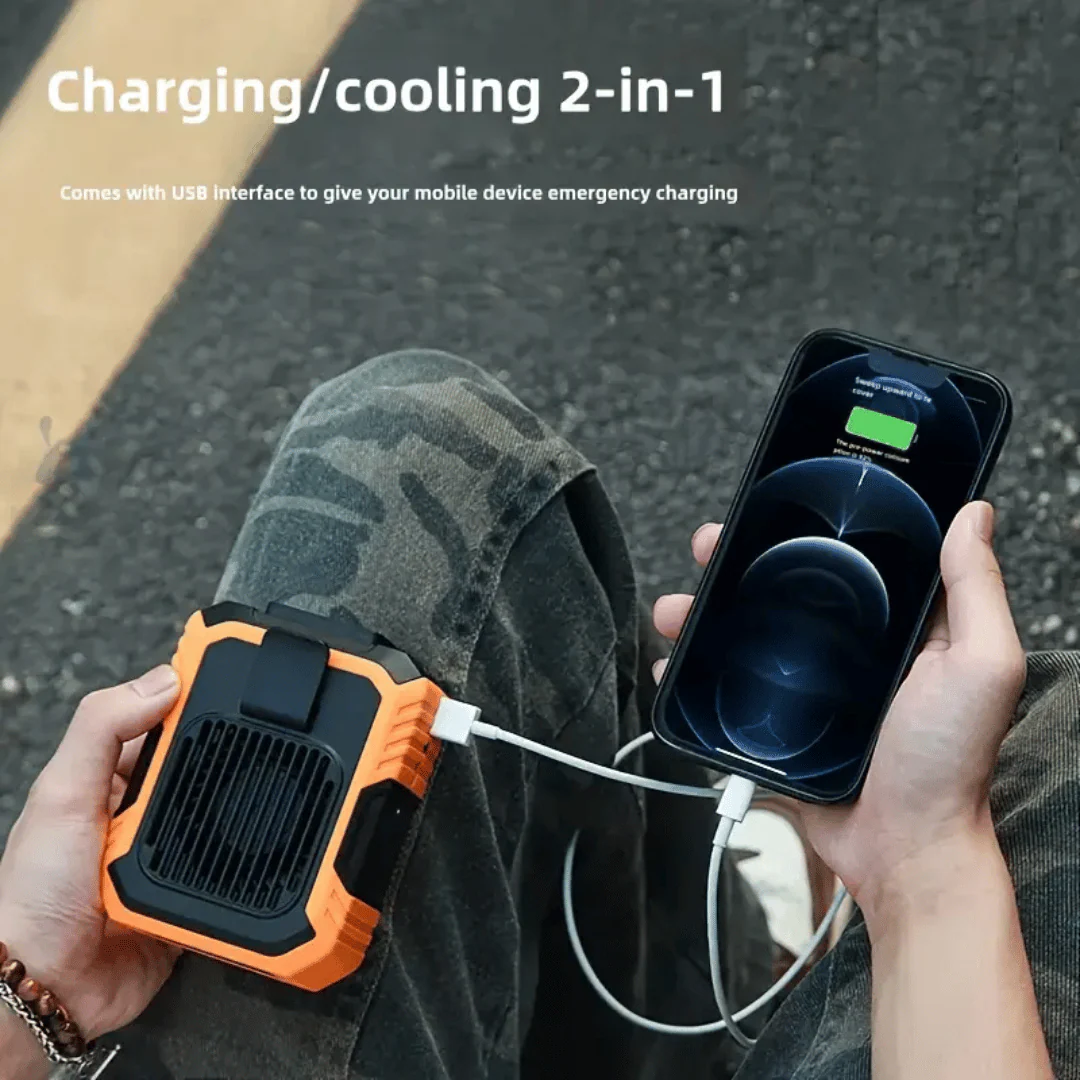 Person using a portable device with USB interface to charge a smartphone on a road.