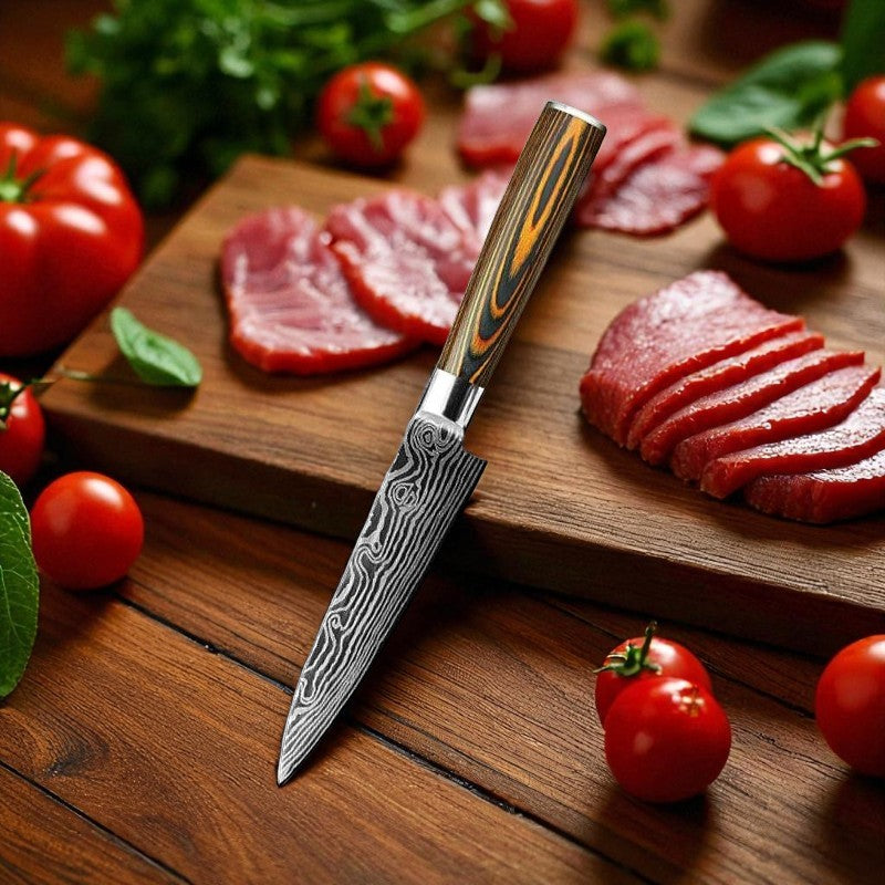 Wooden cutting board with sliced meat, a knife, and tomatoes on a wooden surface