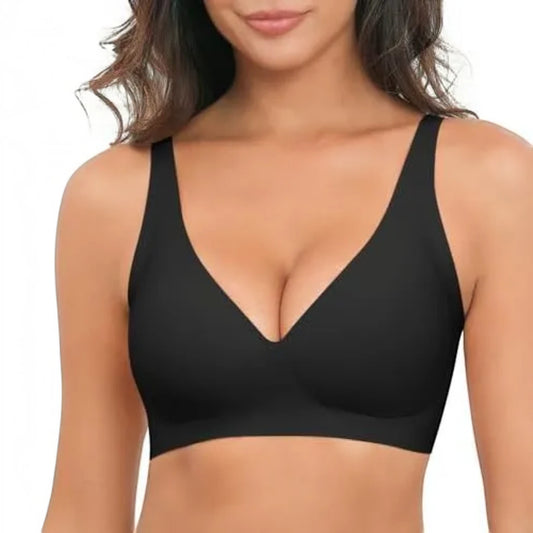 A woman wearing a black wireless bra with a deep V-neckline, shown from the chest up against a plain white background.