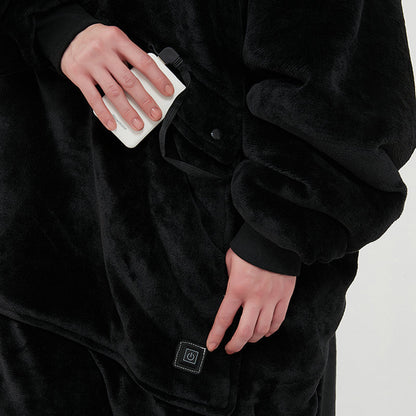 Person wearing a black robe with heated patches on a plain background