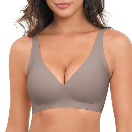 Woman wearing a beige bra on a white background