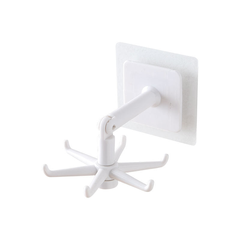 White wall hook with multiple hooks on a white background