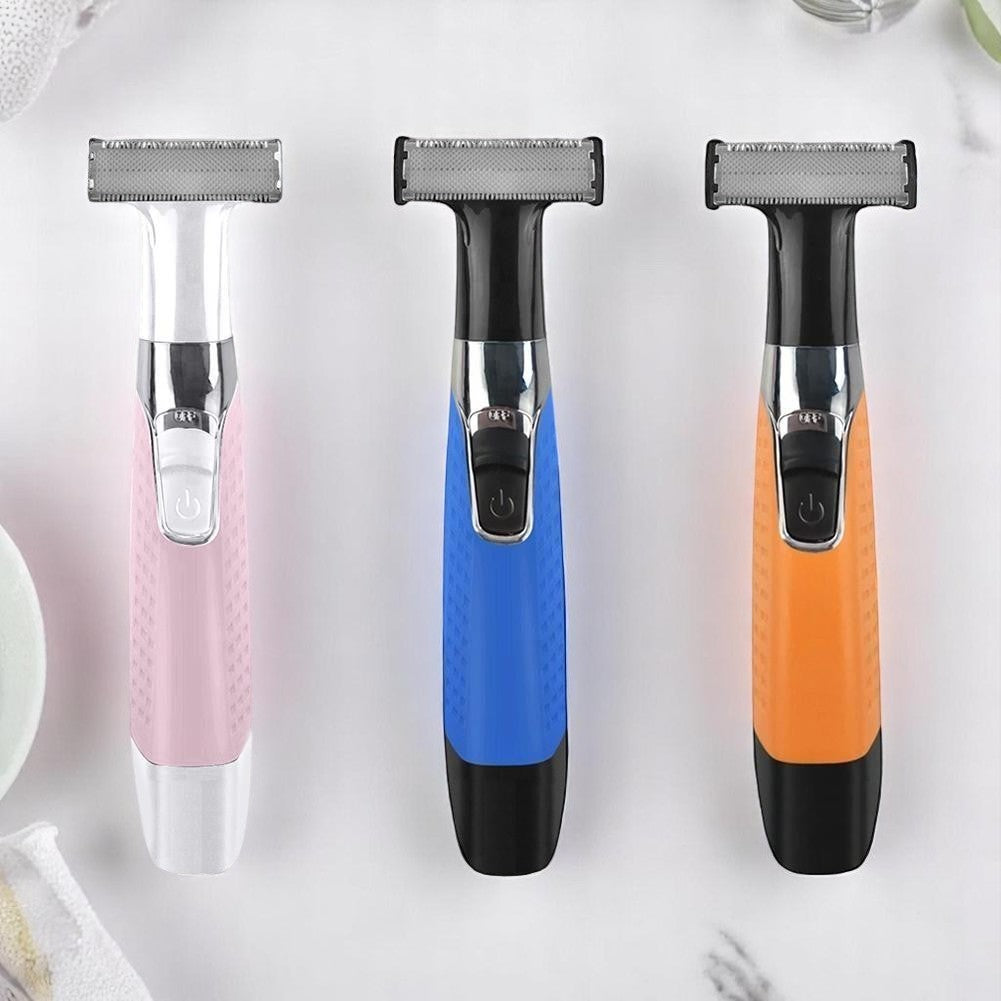 Three electric razors in pink, blue, and orange on a white background.
