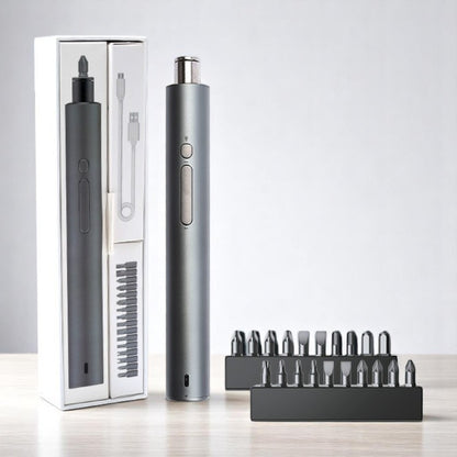 Silver electronic device with accessories on a light gray background