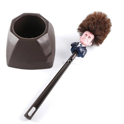 Cleaning brush with a character head attached to a holder on a white background