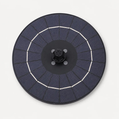 A circular solar panel array with dark blue photovoltaic cells, a black central hub, and white ring connectors, shown from a top-down view on a light gray background.