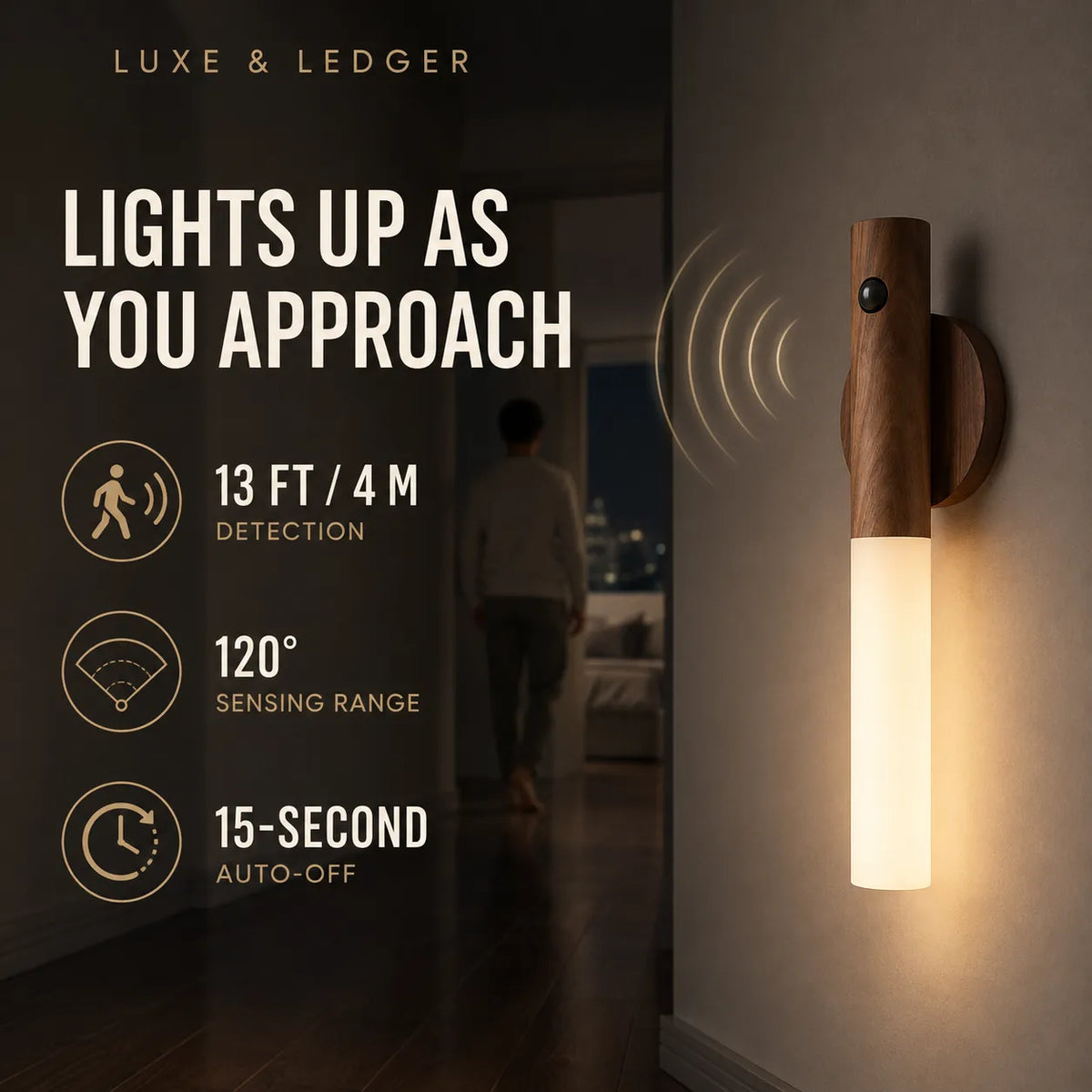 A Luxe & Ledger smart wall light shown mounted on a wall in a hallway at night, with a person walking away in the background. The light has a dark wood top and a glowing warm white cylindrical shade.