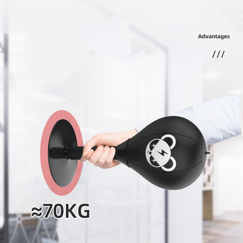 Black boxing bag with panda design held by a hand, labeled '70KG', against a blurred indoor background.