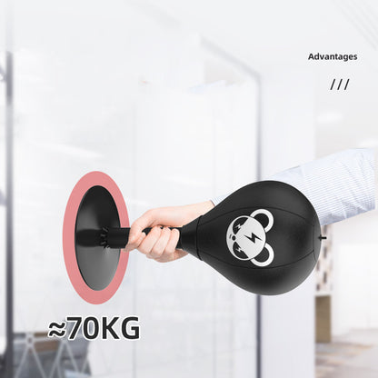 Black boxing bag with panda design held by a hand, labeled '70KG', against a blurred indoor background.
