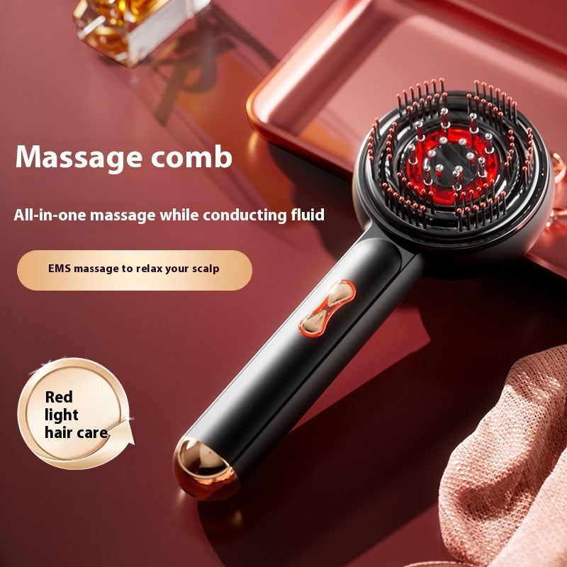 Massage comb with red light hair care feature on a dark background