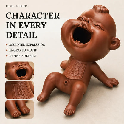 A terracotta-colored laughing baby figurine shown on a light beige background, with text reading 'CHARACTER IN EVERY DETAIL' and two small inset close-ups of the engraved chest motif. Brand text 'LUXE & LEDGER' is visible at the top left.