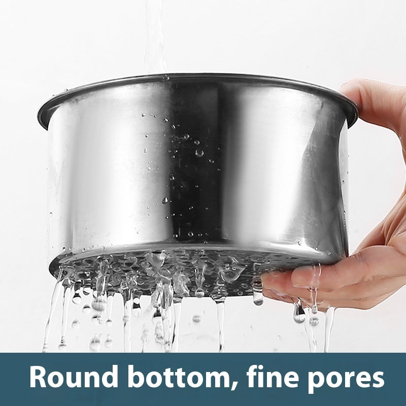 Stainless steel pot with water dripping from its round bottom and fine pores, held by a hand.