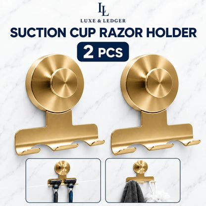 Two gold suction cup razor holders shown on a white marble background, with product text reading 'SUCTION CUP RAZOR HOLDER' and '2 PCS'. Two small inset photos at the bottom demonstrate the holders mounted and holding razors and towels.
