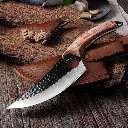 Knife with wooden handle and leather sheath on a wooden surface