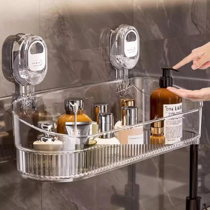 Clear shower caddy with various bottles on a marble wall background
