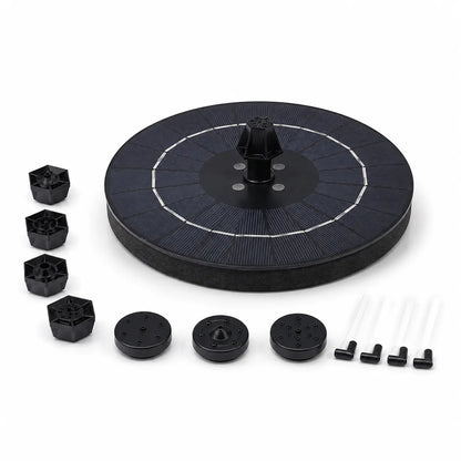 Solar pump kit components on a white background, including a circular solar panel float, several black plastic pump parts, white tubing, and mounting hardware.