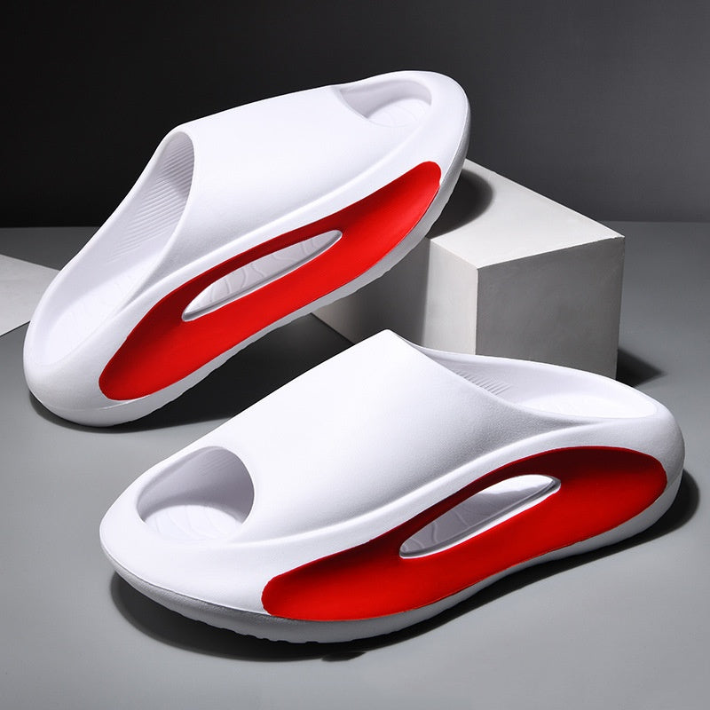 A single black and white summer slide with a sleek resistant design, placed against a patterned background with text highlighting 'GREAT GRIP FOR ANY SCENARIO' and 'SLICK RESISTANT DESIGN'.