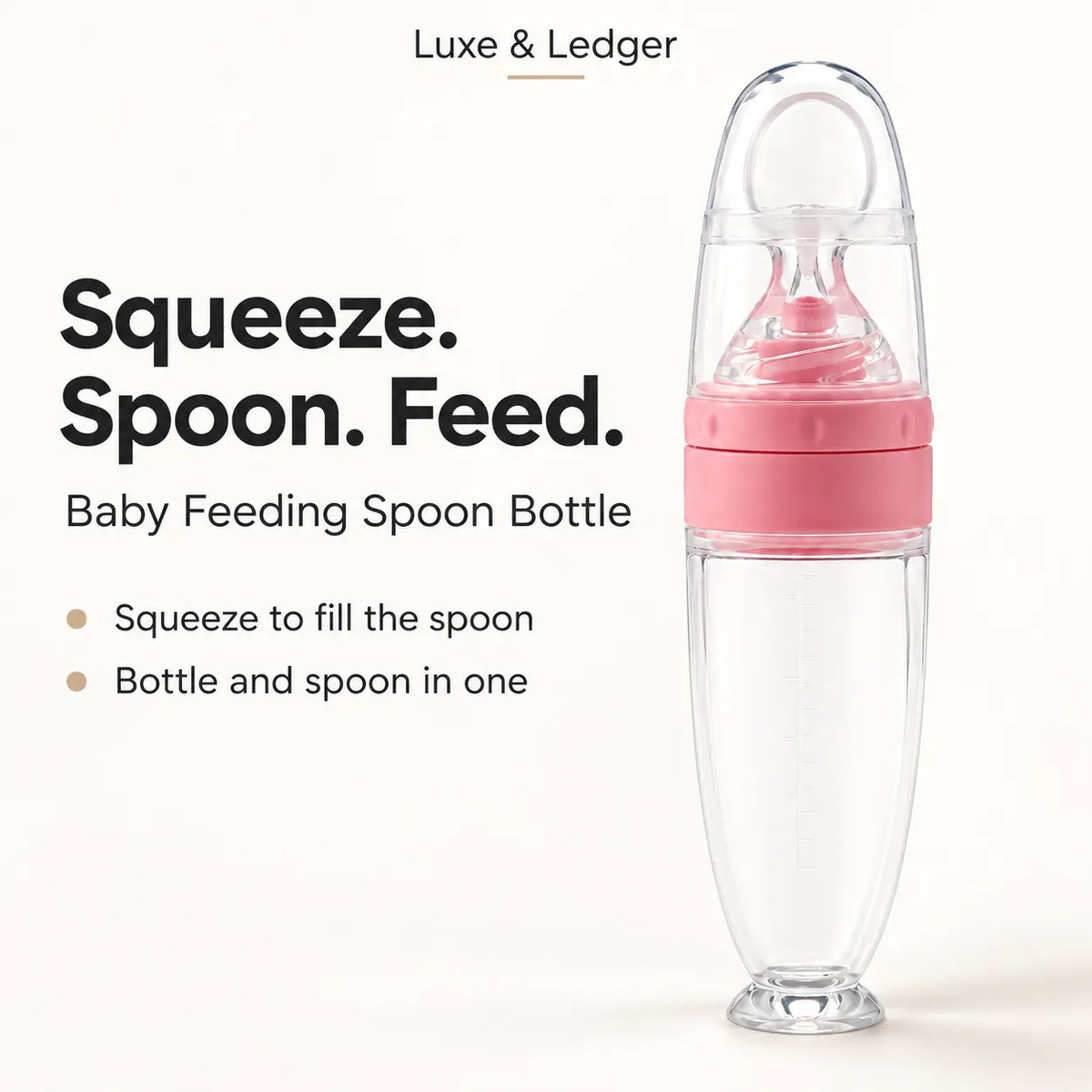 A clear baby feeding spoon bottle with a pink middle section and a transparent lid, shown on a light beige background with promotional text reading 'Squeeze. Spoon.
