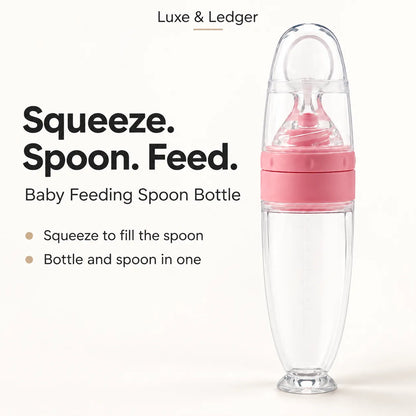 A clear baby feeding spoon bottle with a pink middle section and a transparent lid, shown on a light beige background with promotional text reading 'Squeeze. Spoon.
