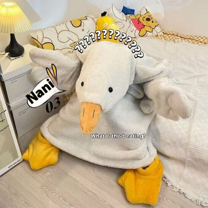 Plush toy resembling a duck with a confused expression on a bed