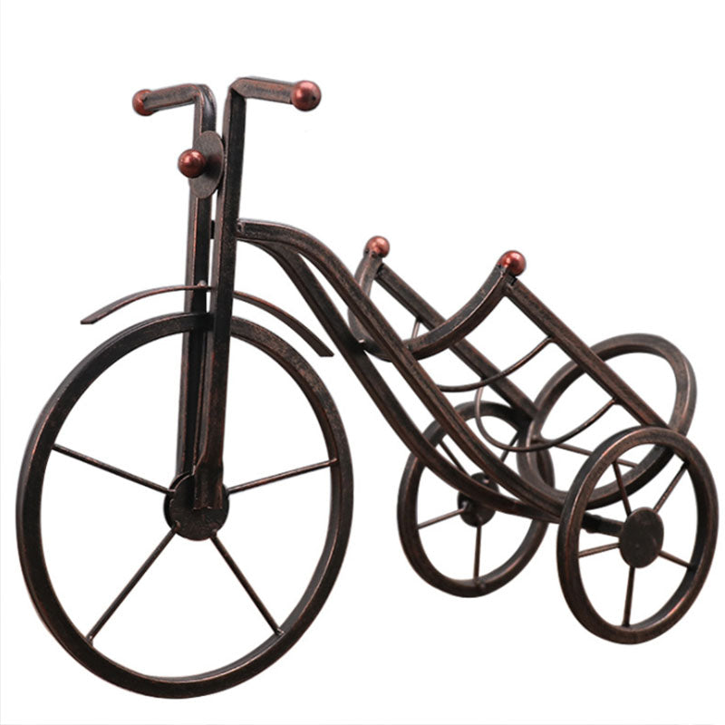 Decorative metal bike sculpture on a white background