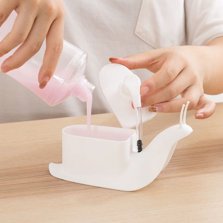 Person pouring liquid from a small container into a white silicone funnel on a wooden surface.