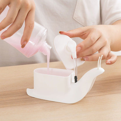 Person pouring liquid from a small container into a white silicone funnel on a wooden surface.