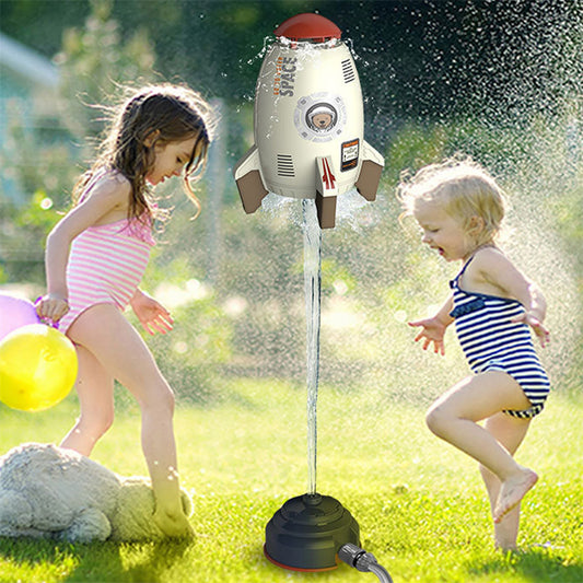 Children playing with a space-themed water sprayer in a garden
