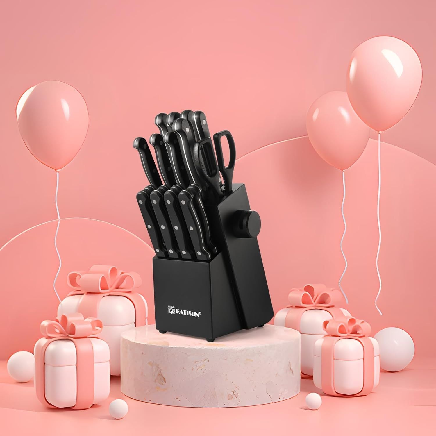 Knife set in a black block with pink balloons and gift boxes on a pink background