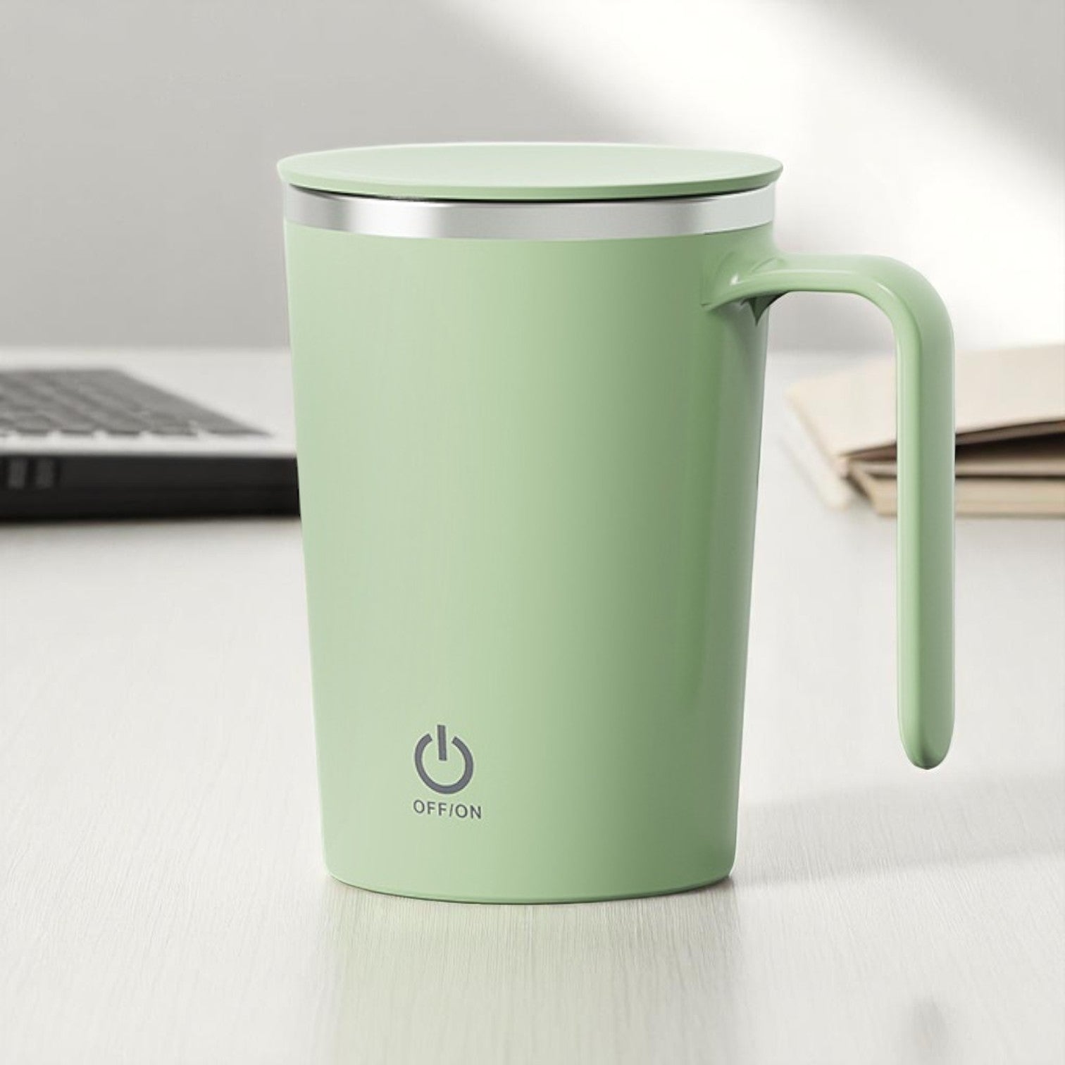 Green mug with a power symbol on a light surface