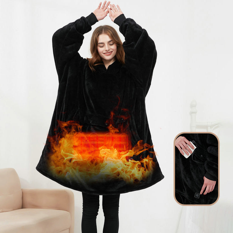 Person wearing a black hoodie with flame design, sitting on a couch.