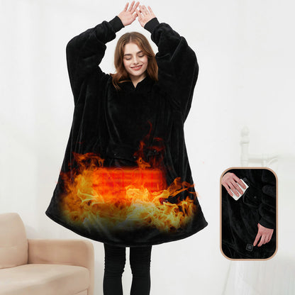 Person wearing a black hoodie with flame design, sitting on a couch.