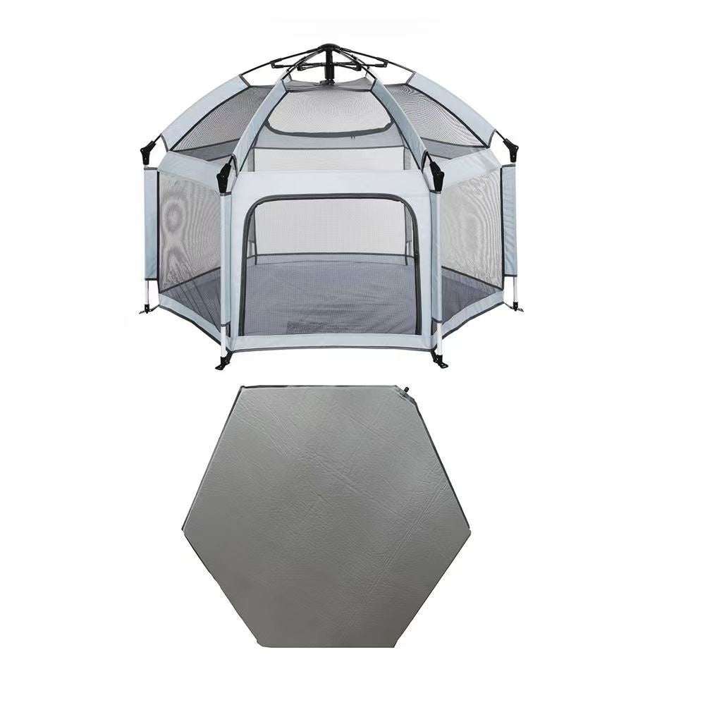Hexagonal pet playpen with mesh sides and a gray mat on a white background