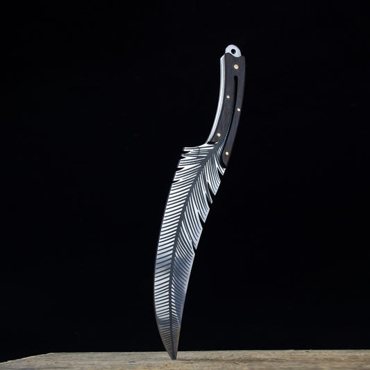 Forked knife with feather design on a black background